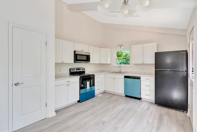 3910 Brock Rd, Chattanooga, TN 37421 - kitchen with freestanding refrigerator, dishwasher, range with electric stovetop, white cabinets, and high vaulted ceiling