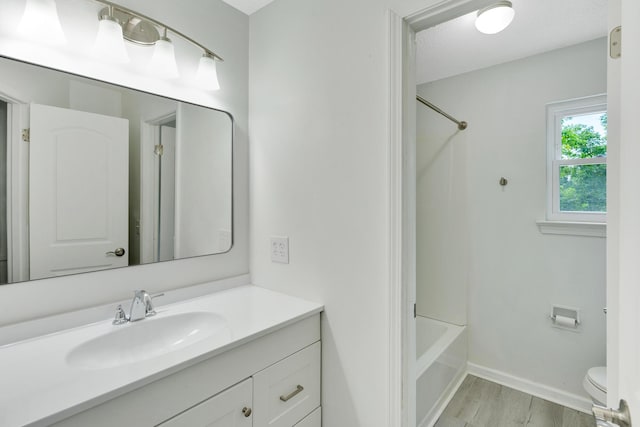 3910 Brock Rd, Chattanooga, TN 37421 - full bath featuring vanity, wood finished floors, and washtub / shower combination
