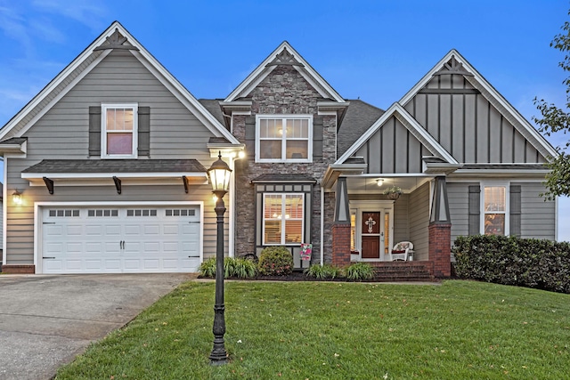 8802 Mckenzie Farm Dr, Ooltewah, TN 37363 - craftsman-style home featuring concrete driveway, a front yard, board and batten siding, an attached garage, and stone siding