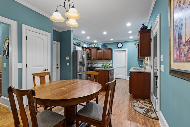 8802 Mckenzie Farm Dr, Ooltewah, TN 37363 - dining room featuring ornamental molding, light wood finished floors, baseboards, a chandelier, and recessed lighting