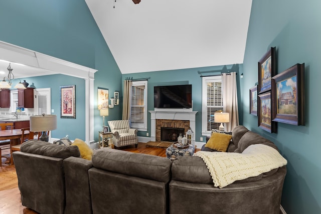 8802 Mckenzie Farm Dr, Ooltewah, TN 37363 - living area with wood finished floors, high vaulted ceiling, ceiling fan, and a fireplace