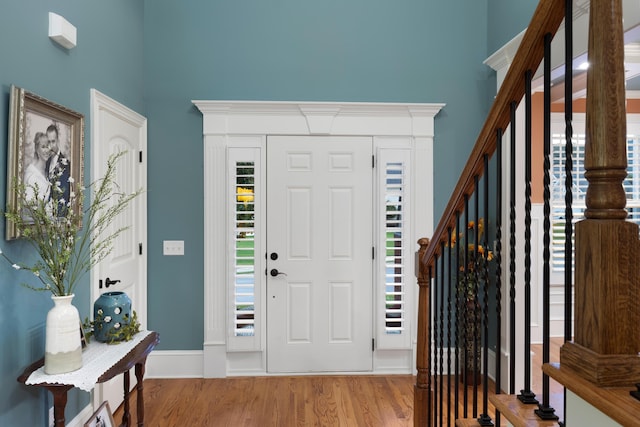 8802 Mckenzie Farm Dr, Ooltewah, TN 37363 - foyer entrance featuring a towering ceiling, wood finished floors, and stairway