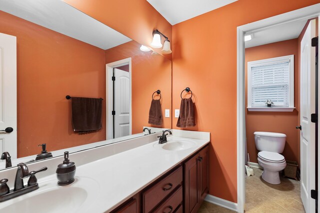 8802 Mckenzie Farm Dr, Ooltewah, TN 37363 - full bath with toilet, baseboards, double vanity, and tile patterned flooring