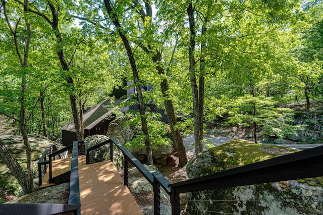 exterior space featuring a forest view