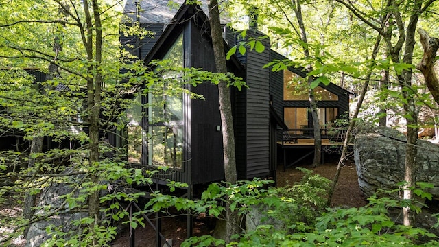 view of side of property featuring a deck