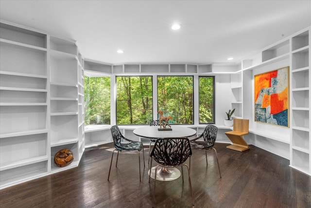 dining area with healthy amount of natural light, wood finished floors, recessed lighting, and built in features