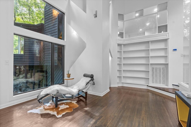 living area featuring wood finished floors and baseboards