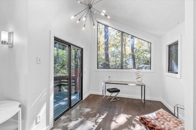 office featuring wood finished floors, baseboards, and a chandelier