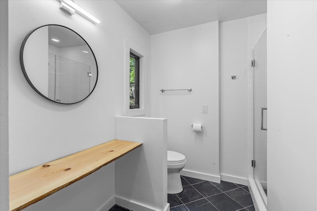 full bath with toilet, a stall shower, tile patterned flooring, and baseboards