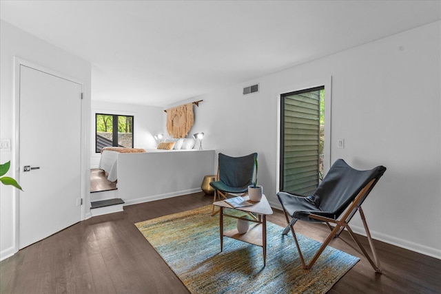 sitting room featuring wood finished floors and baseboards