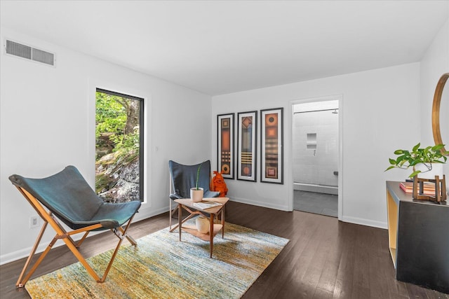 sitting room featuring dark wood-style floors and baseboards