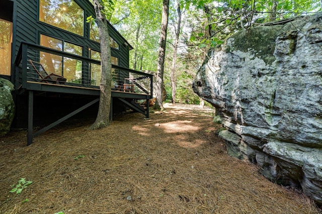 view of yard featuring a deck and stairway