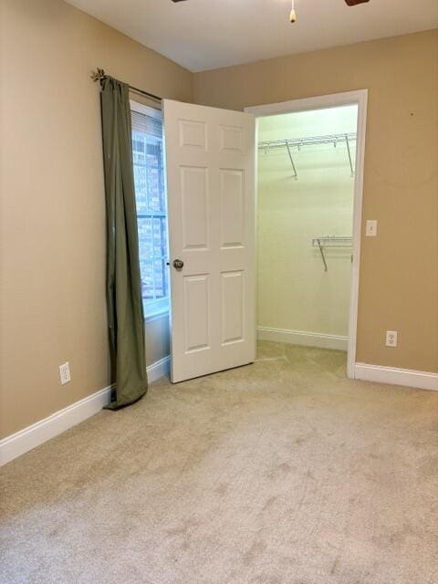 1501 Applebrook Dr, Rossville, GA 30741 - unfurnished bedroom with light carpet, baseboards, ceiling fan, and a closet