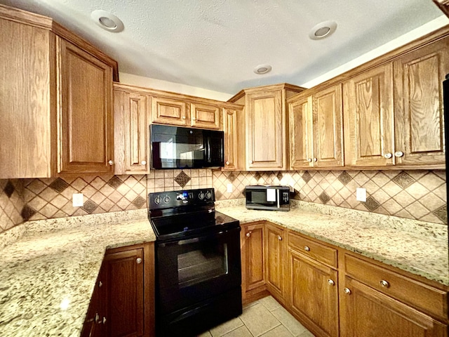 1501 Applebrook Dr, Rossville, GA 30741 - kitchen featuring black appliances, backsplash, and light stone countertops
