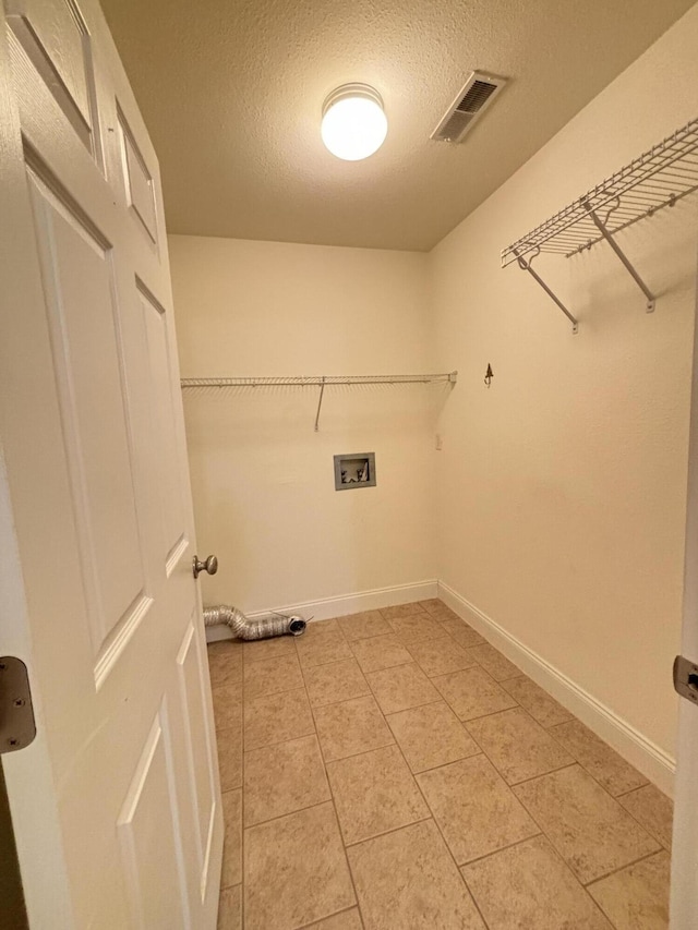 1501 Applebrook Dr, Rossville, GA 30741 - laundry room with washer hookup, a textured ceiling, light tile patterned flooring, and baseboards