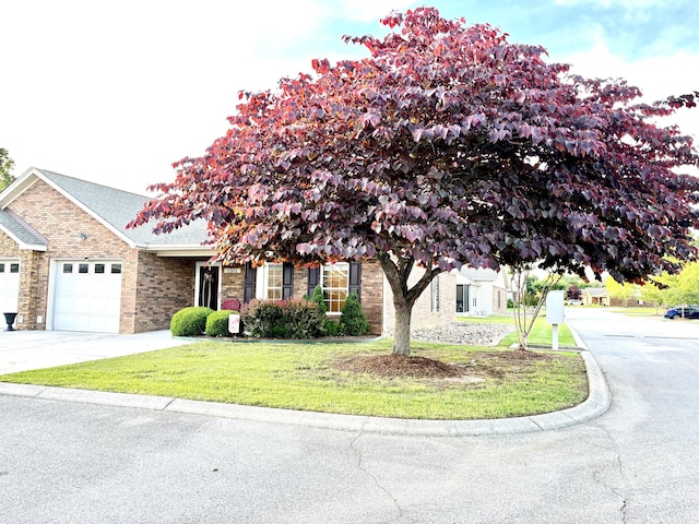 1501 Applebrook Dr, Rossville, GA 30741 - view of front of house featuring a garage, brick siding, a front yard, and concrete driveway