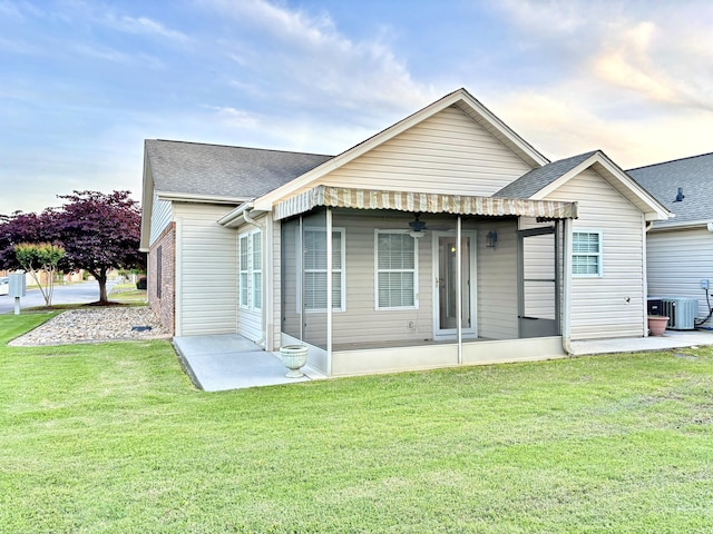 1501 Applebrook Dr, Rossville, GA 30741 - rear view of house featuring a yard, a patio area, and roof with shingles