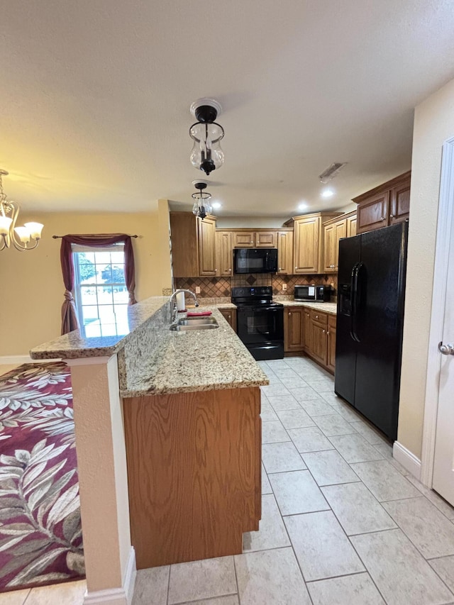 1501 Applebrook Dr, Rossville, GA 30741 - kitchen featuring black appliances, a sink, a peninsula, backsplash, and brown cabinets