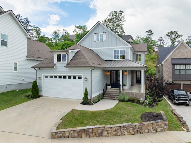 1328 Carrington Way, Chattanooga, TN 37405 - craftsman house featuring board and batten siding, a porch, an attached garage, a front yard, and a shingled roof
