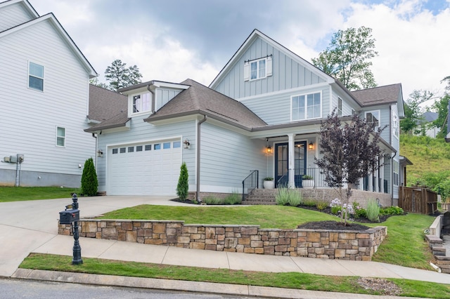 1328 Carrington Way, Chattanooga, TN 37405 - view of front of property featuring board and batten siding, an attached garage, driveway, covered porch, and a front yard