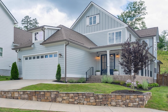 1328 Carrington Way, Chattanooga, TN 37405 - view of front of house with board and batten siding, covered porch, concrete driveway, an attached garage, and a shingled roof