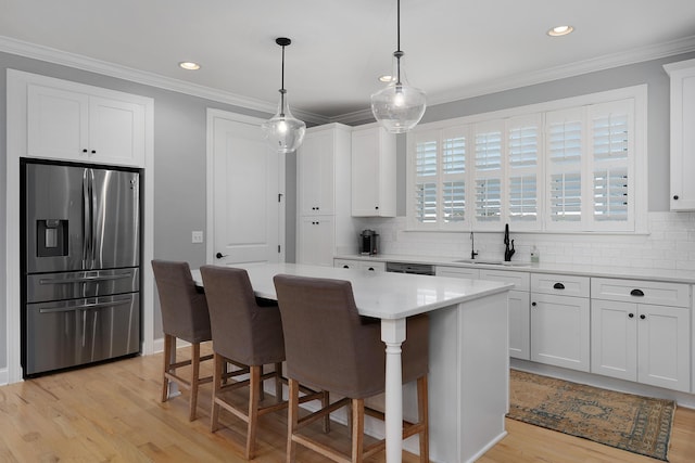 1328 Carrington Way, Chattanooga, TN 37405 - kitchen with stainless steel refrigerator with ice dispenser, a sink, decorative backsplash, light wood-style floors, and white cabinetry