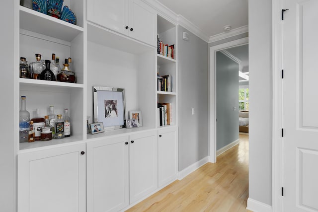 1328 Carrington Way, Chattanooga, TN 37405 - corridor with light wood-style flooring, crown molding, baseboards, and built in shelves