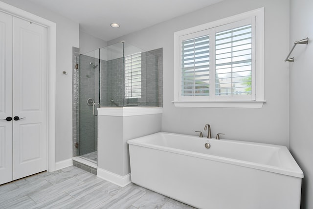 1328 Carrington Way, Chattanooga, TN 37405 - bathroom featuring a shower stall, a freestanding bath, baseboards, and recessed lighting