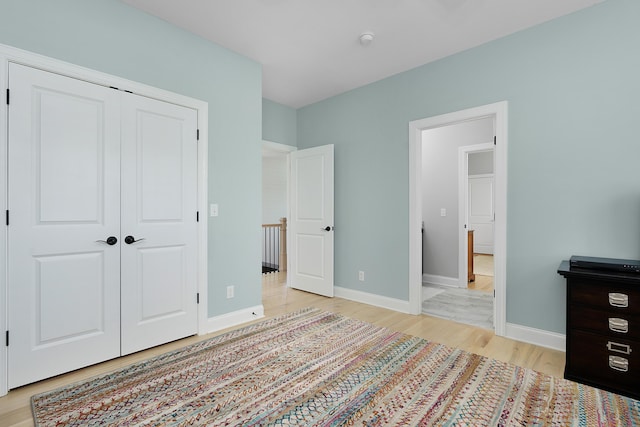 1328 Carrington Way, Chattanooga, TN 37405 - unfurnished bedroom featuring light wood-style flooring, baseboards, and a closet