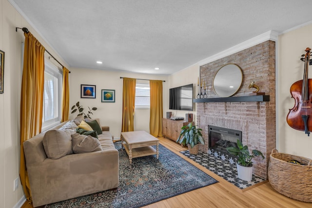 3804 Northview Ave, Chattanooga, TN 37412 - living room featuring wood finished floors, a textured ceiling, a brick fireplace, and ornamental molding