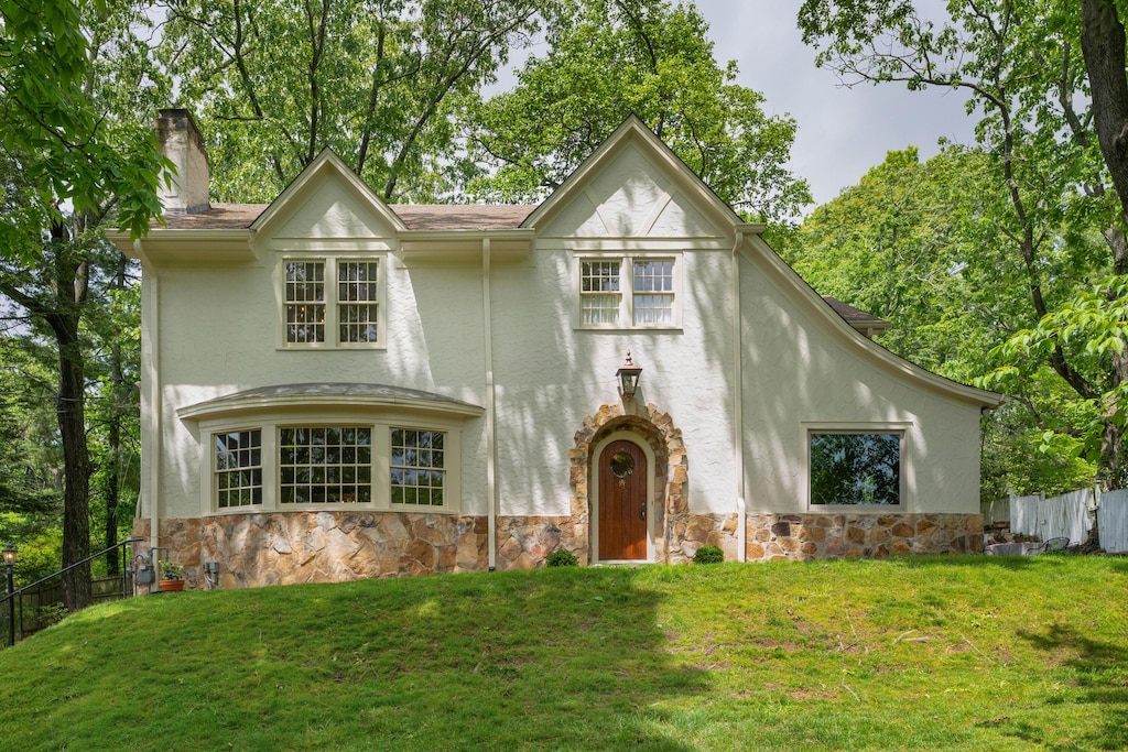 1102 Tinkerbell Ln, Lookout Mountain, GA 30750 - tudor house with a chimney, stone siding, and stucco siding