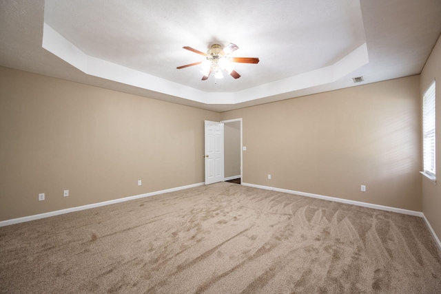 14 Castleview Ct, Ringgold, GA 30736 - spare room with a raised ceiling, a ceiling fan, carpet floors, and baseboards