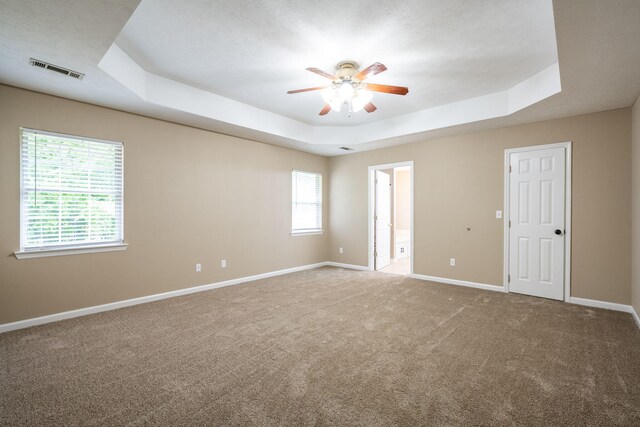 14 Castleview Ct, Ringgold, GA 30736 - unfurnished room featuring a raised ceiling, a ceiling fan, carpet floors, and baseboards