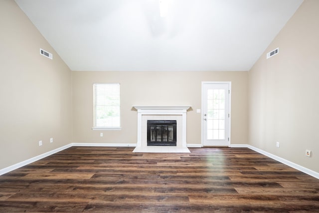 14 Castleview Ct, Ringgold, GA 30736 - unfurnished living room featuring lofted ceiling, baseboards, a tiled fireplace, and dark wood finished floors