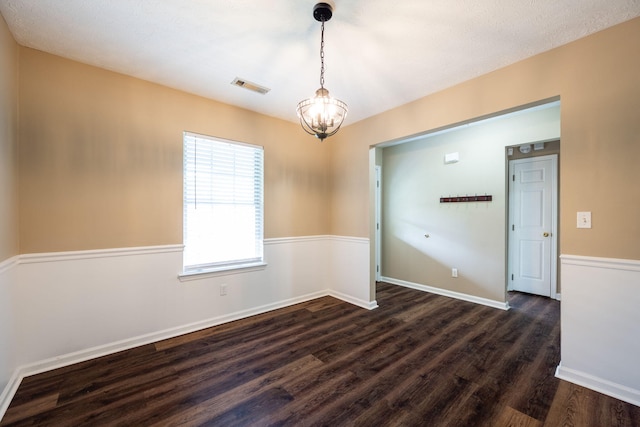 14 Castleview Ct, Ringgold, GA 30736 - empty room featuring a chandelier, dark wood-type flooring, and baseboards