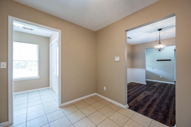 14 Castleview Ct, Ringgold, GA 30736 - unfurnished room featuring light tile patterned floors, baseboards, and a chandelier