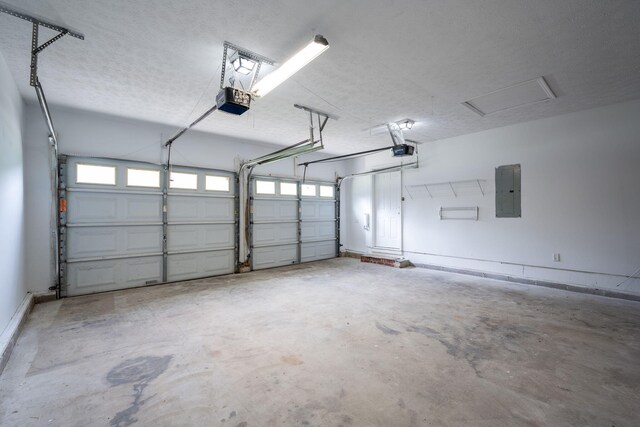 14 Castleview Ct, Ringgold, GA 30736 - garage featuring electric panel and a garage door opener