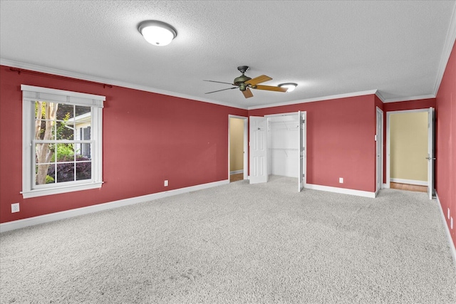 1578 Old Ringgold Rd, Rocky Face, GA 30740 - unfurnished bedroom featuring a textured ceiling, crown molding, baseboards, a closet, and carpet flooring