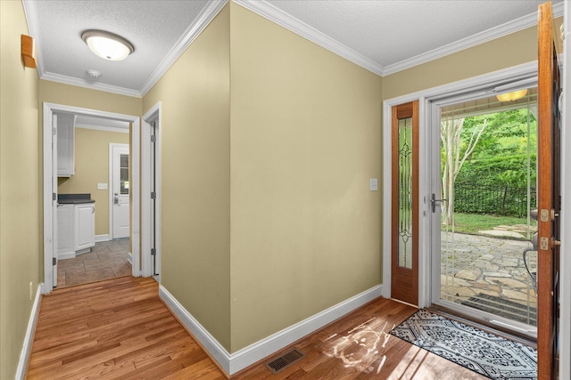 1578 Old Ringgold Rd, Rocky Face, GA 30740 - entrance foyer with a textured ceiling, baseboards, light wood-type flooring, and ornamental molding