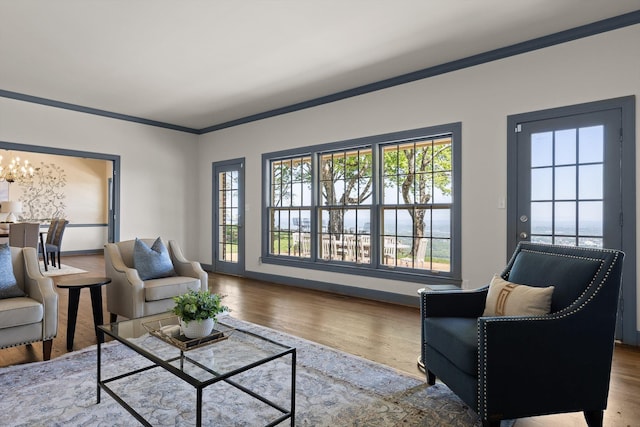 1116 Cumberland Rd, Chattanooga, TN 37419 - living room with a chandelier, wood finished floors, and ornamental molding