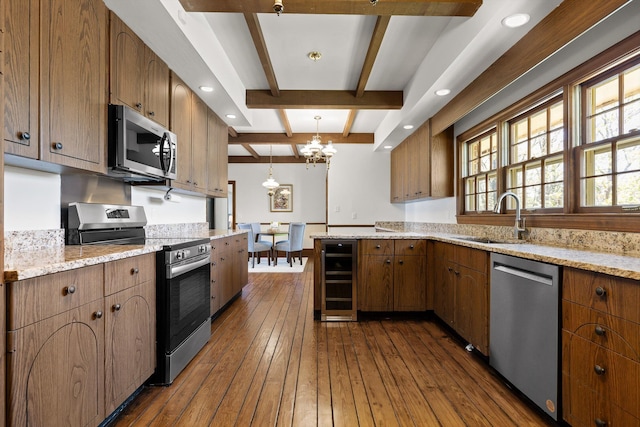 1116 Cumberland Rd, Chattanooga, TN 37419 - kitchen featuring stainless steel appliances, beverage cooler, beamed ceiling, a chandelier, and dark wood-style flooring