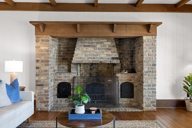 1116 Cumberland Rd, Chattanooga, TN 37419 - living area with a brick fireplace, wood-type flooring, beamed ceiling, and wood walls