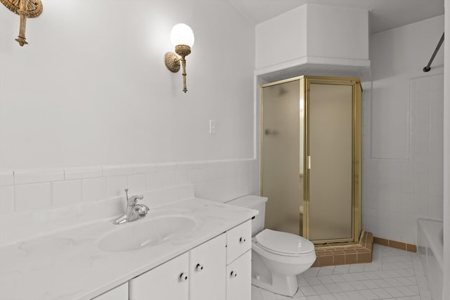 1116 Cumberland Rd, Chattanooga, TN 37419 - bathroom featuring a stall shower, tile patterned flooring, tile walls, vanity, and a tub to relax in