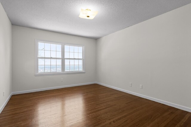 1116 Cumberland Rd, Chattanooga, TN 37419 - empty room featuring dark wood-style flooring and a textured ceiling