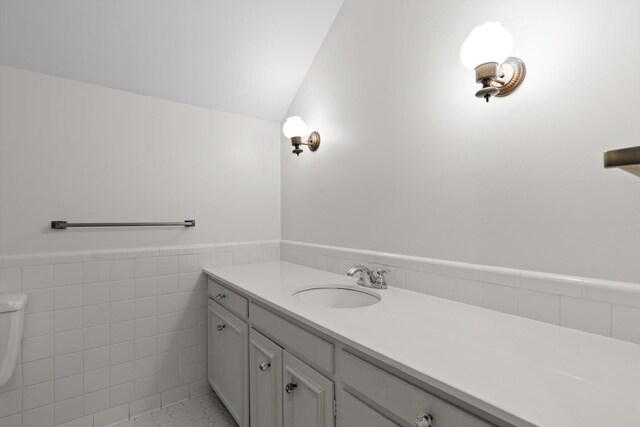 1116 Cumberland Rd, Chattanooga, TN 37419 - bathroom featuring vanity, a wainscoted wall, and tile walls