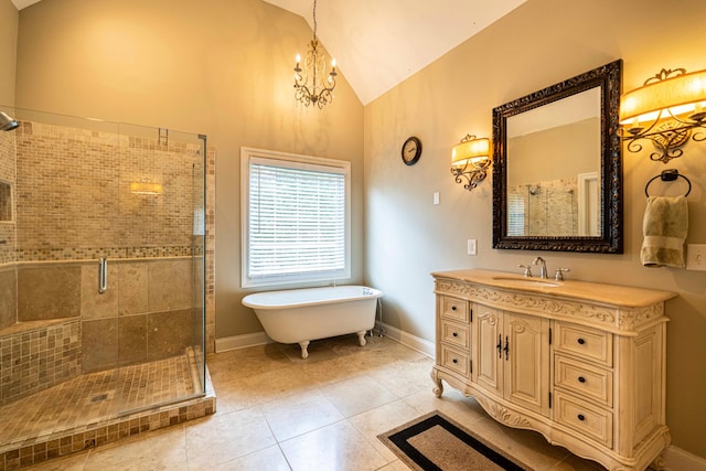 full bath with a chandelier, a shower stall, a soaking tub, vanity, and tile patterned floors