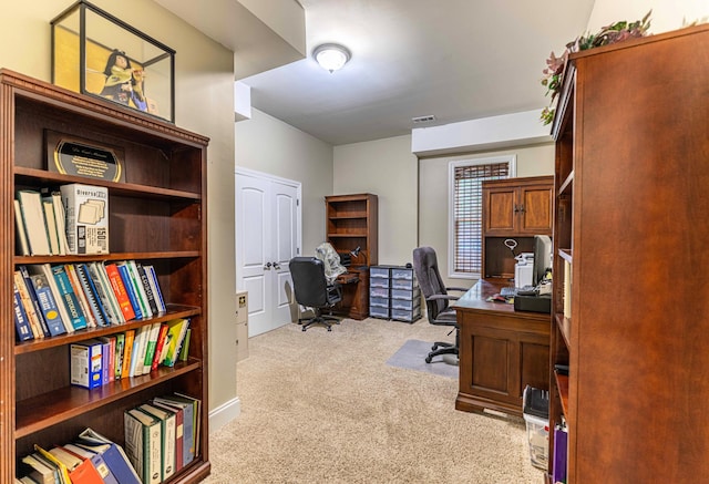 office space featuring light carpet