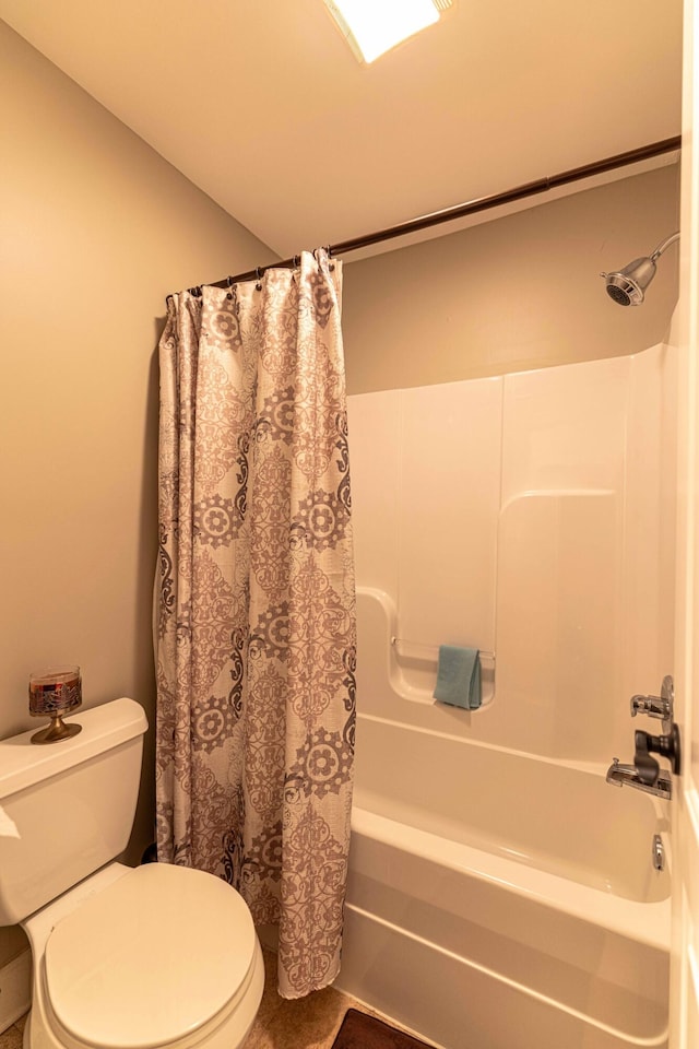 full bathroom with toilet and shower / bath combo with shower curtain