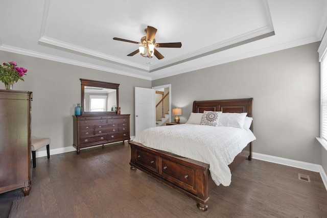7310 Huntley Ln, Chattanooga, TN 37421 - bedroom with a raised ceiling, dark wood-style flooring, ornamental molding, and ceiling fan