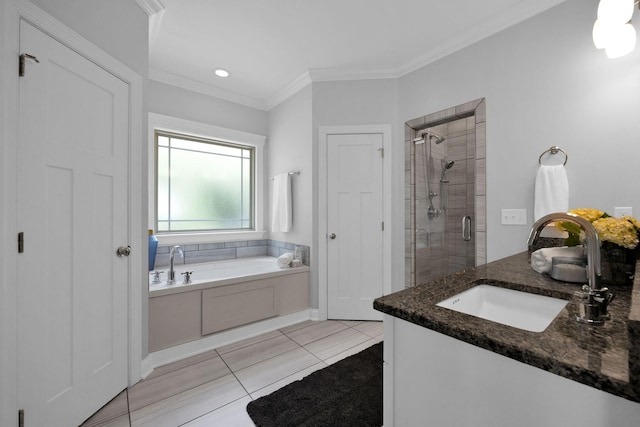 7310 Huntley Ln, Chattanooga, TN 37421 - bathroom with a stall shower, a garden tub, ornamental molding, vanity, and tile patterned floors